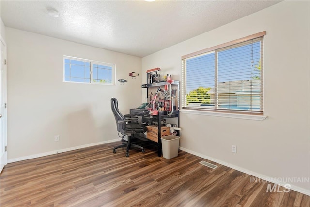 2175 W Willow Pointe Ave, Nampa, ID 83651 - office space featuring healthy amount of natural light, wood finished floors, baseboards, and a textured ceiling