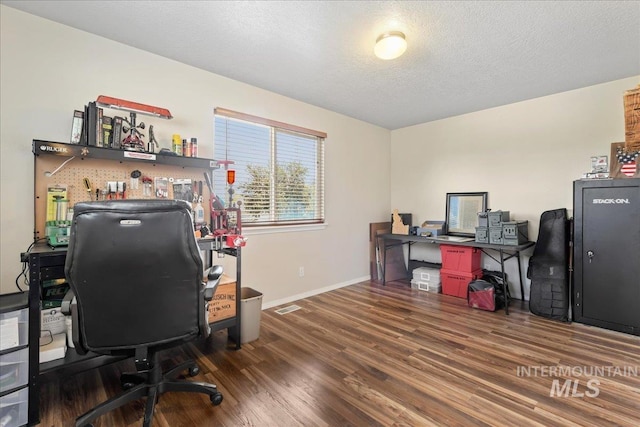 2175 W Willow Pointe Ave, Nampa, ID 83651 - office with wood finished floors, baseboards, and a textured ceiling