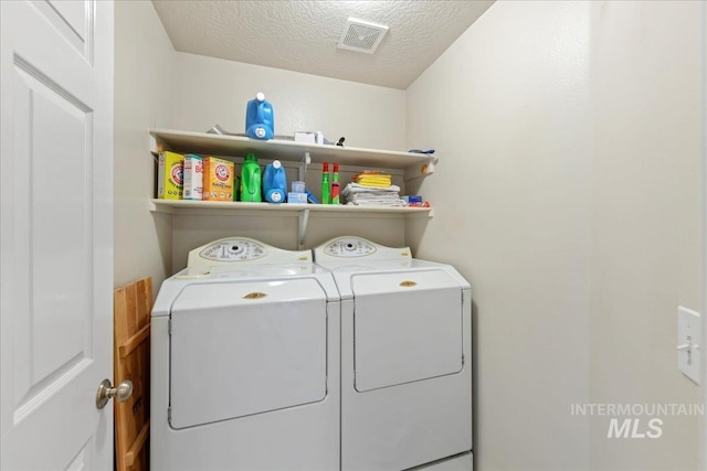 2175 W Willow Pointe Ave, Nampa, ID 83651 - laundry area with washer and clothes dryer and a textured ceiling