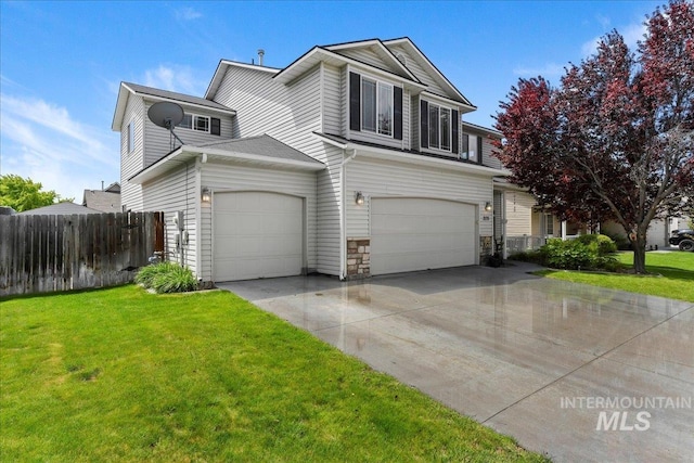 2175 W Willow Pointe Ave, Nampa, ID 83651 - traditional home featuring an attached garage, driveway, and stone siding