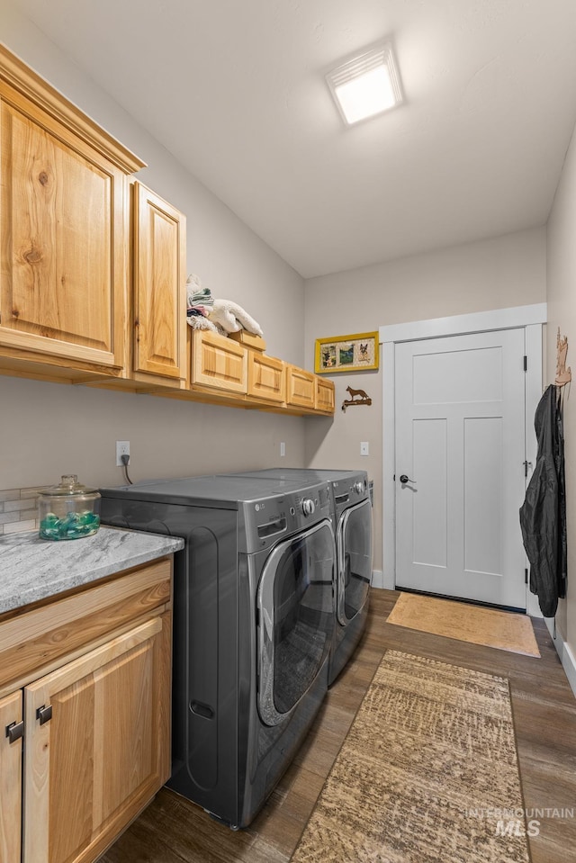 656 Fox Ridge Ln, Mccall, ID 83638 - laundry area with cabinet space, washer and clothes dryer, and dark wood-style floors