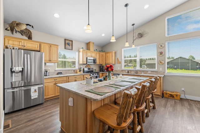 656 Fox Ridge Ln, Mccall, ID 83638 - kitchen featuring stainless steel appliances, a center island, wood finished floors, light brown cabinets, and recessed lighting