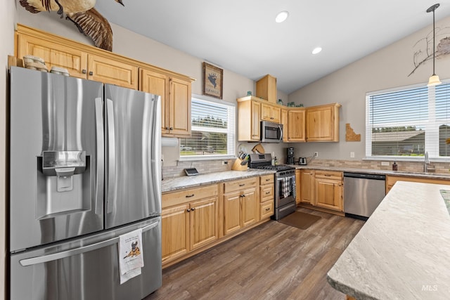 656 Fox Ridge Ln, Mccall, ID 83638 - kitchen with appliances with stainless steel finishes, dark wood finished floors, recessed lighting, vaulted ceiling, and decorative light fixtures
