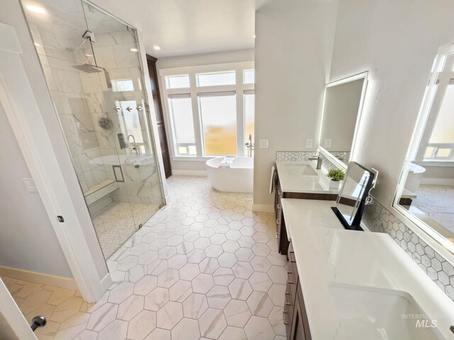 7063 S Pear Blossom, Meridian, ID 83642 - bathroom featuring double vanity, a stall shower, a soaking tub, tile patterned floors, and recessed lighting