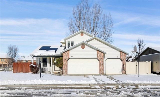 front facade with a garage and covered porch