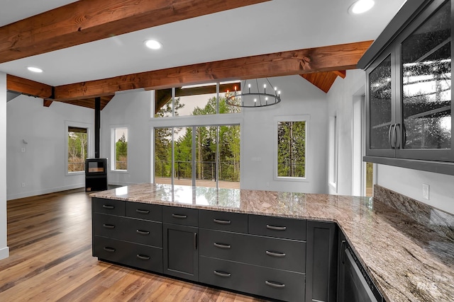 1 Caribou Pkwy, Cascade, ID 83611 - kitchen featuring plenty of natural light, light stone countertops, a chandelier, baseboards, and recessed lighting