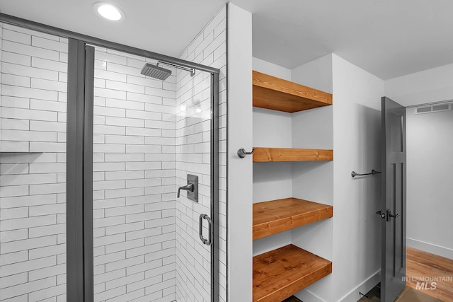 1 Caribou Pkwy, Cascade, ID 83611 - bathroom featuring a stall shower, baseboards, wood finished floors, and recessed lighting