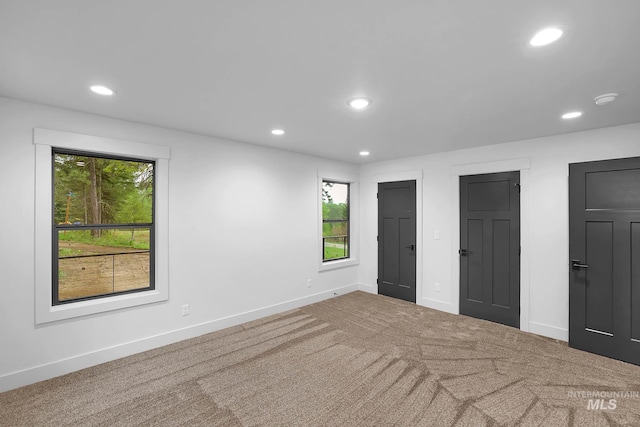1 Caribou Pkwy, Cascade, ID 83611 - unfurnished bedroom featuring multiple windows, recessed lighting, carpet, and baseboards