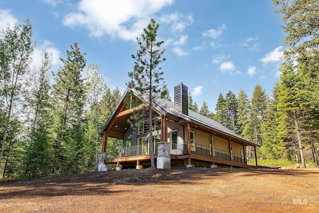 1 Caribou Pkwy, Cascade, ID 83611 - view of front of home with a chimney and covered porch