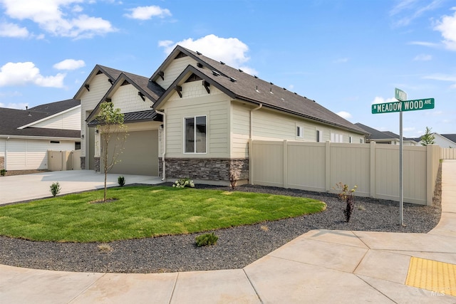 view of side of home featuring a yard and a garage