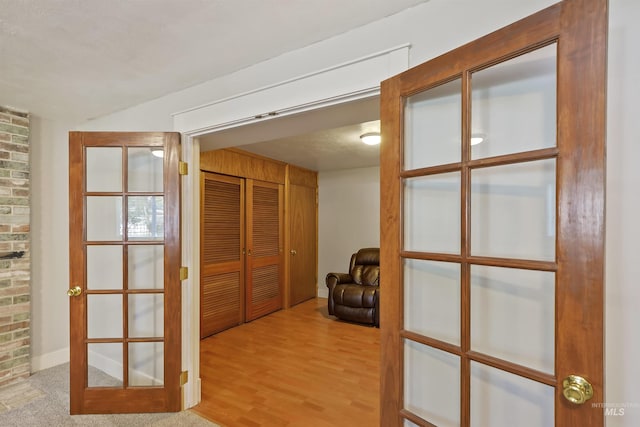 hallway featuring wood finished floors