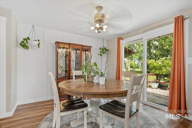 3600 S Robinson Blvd, Nampa, ID 83686 - dining room featuring light wood-style floors, a chandelier, and a decorative wall