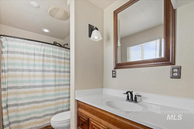 3600 S Robinson Blvd, Nampa, ID 83686 - bathroom featuring vanity, a textured wall, and a shower with curtain