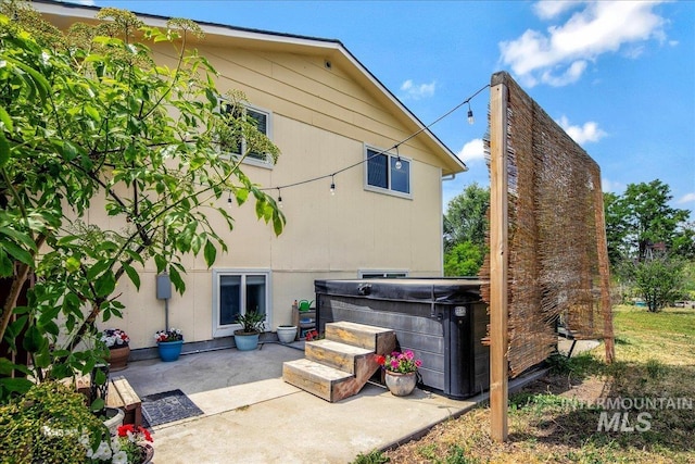 3600 S Robinson Blvd, Nampa, ID 83686 - back of house with a hot tub and a patio area