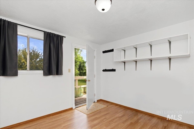3600 S Robinson Blvd, Nampa, ID 83686 - unfurnished room with light wood-style floors and a textured ceiling