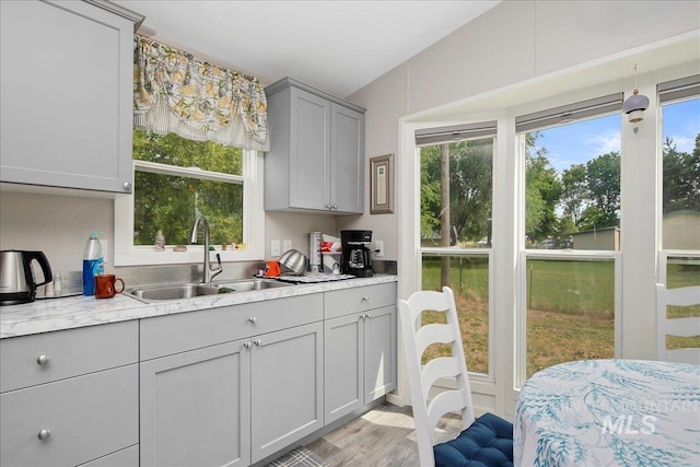 3600 S Robinson Blvd, Nampa, ID 83686 - kitchen featuring gray cabinets, light countertops, and light wood-type flooring