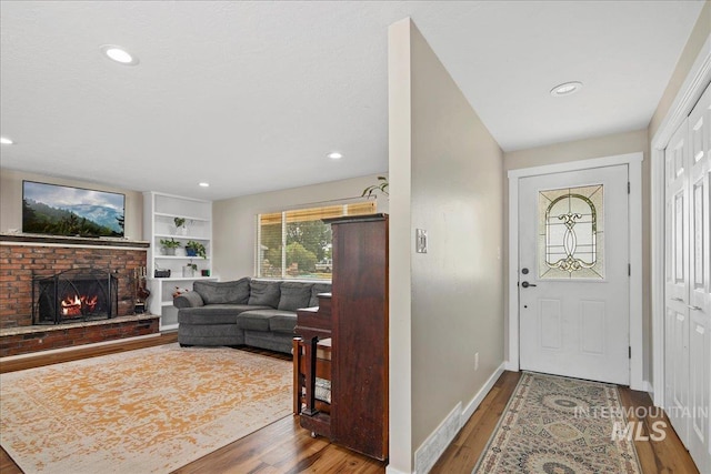 3600 S Robinson Blvd, Nampa, ID 83686 - foyer featuring wood finished floors, a fireplace, and recessed lighting