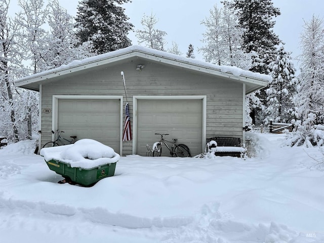 view of snow covered garage