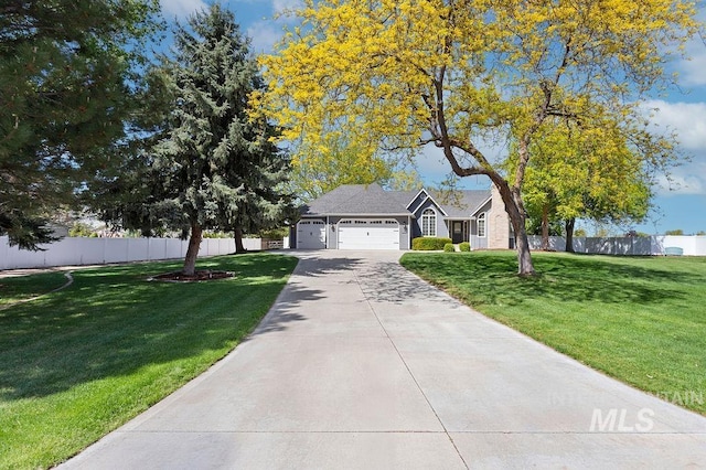 2500 W Orchard Ave, Nampa, ID 83651 - ranch-style house with a garage, a front lawn, fence, and driveway