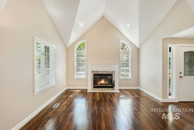 2500 W Orchard Ave, Nampa, ID 83651 - unfurnished living room with a wealth of natural light, a high end fireplace, and hardwood / wood-style floors