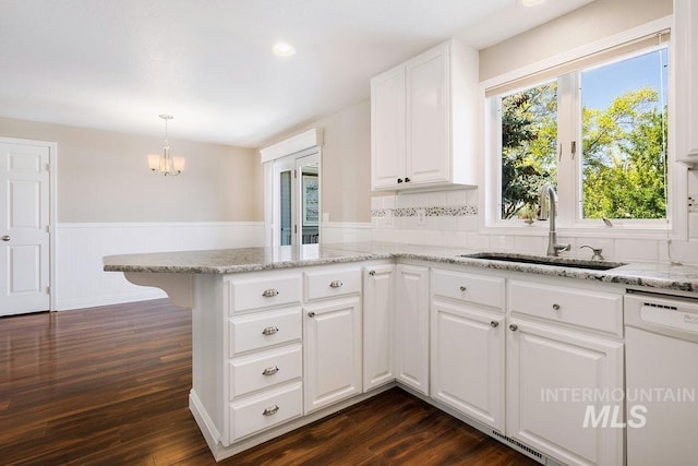2500 W Orchard Ave, Nampa, ID 83651 - kitchen with an inviting chandelier, wainscoting, a sink, dishwasher, and a peninsula