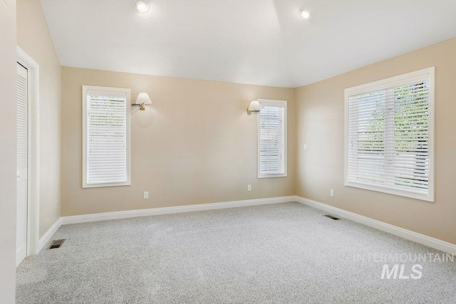 2500 W Orchard Ave, Nampa, ID 83651 - carpeted empty room featuring baseboards, lofted ceiling, and visible vents