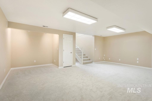 2500 W Orchard Ave, Nampa, ID 83651 - finished below grade area with baseboards, visible vents, light carpet, and stairway
