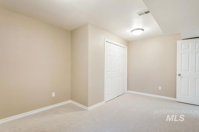 2500 W Orchard Ave, Nampa, ID 83651 - unfurnished bedroom with visible vents, baseboards, a closet, and light carpet