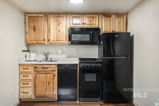 2500 W Orchard Ave, Nampa, ID 83651 - kitchen featuring dark wood-style flooring, a sink, baseboards, a toaster, and black appliances