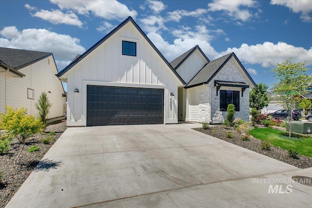 4603 S Hennessy Ave, Meridian, ID 83642 - modern inspired farmhouse featuring board and batten siding, a garage, stone siding, and driveway
