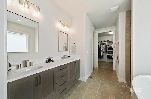 4603 S Hennessy Ave, Meridian, ID 83642 - bathroom with double vanity, a freestanding tub, and a walk in closet