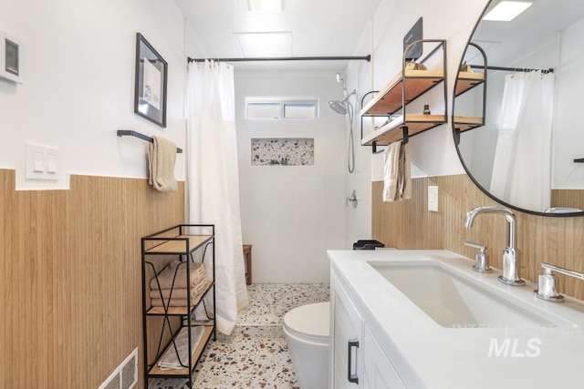 1138 Normal Ave, Burley, ID 83318 - bathroom with wainscoting, vanity, a tile shower, and toilet