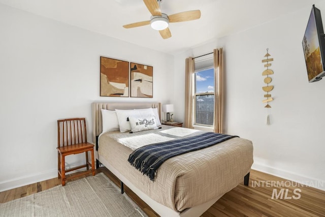 1138 Normal Ave, Burley, ID 83318 - bedroom featuring baseboards, wood finished floors, and ceiling fan