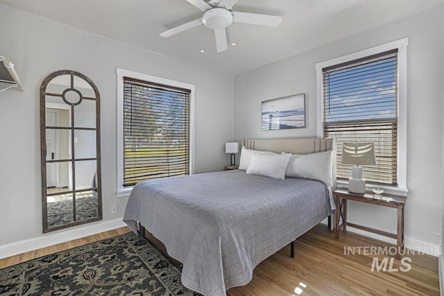 1138 Normal Ave, Burley, ID 83318 - bedroom featuring baseboards, wood finished floors, and a ceiling fan
