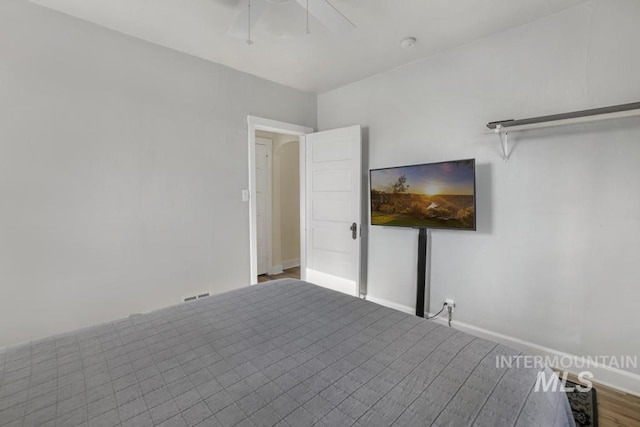 1138 Normal Ave, Burley, ID 83318 - unfurnished bedroom featuring baseboards, ceiling fan, and wood finished floors