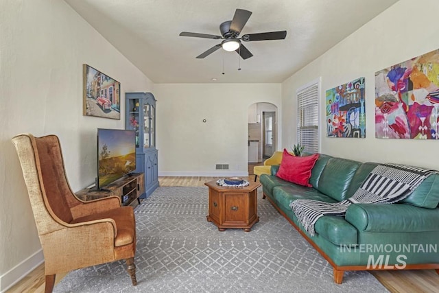 1138 Normal Ave, Burley, ID 83318 - living area with arched walkways, ceiling fan, baseboards, and wood finished floors