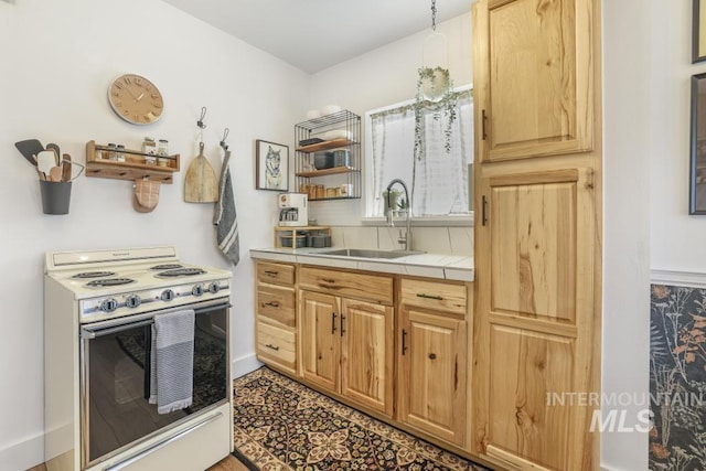 1138 Normal Ave, Burley, ID 83318 - kitchen featuring white electric stove, tile counters, a sink, and open shelves