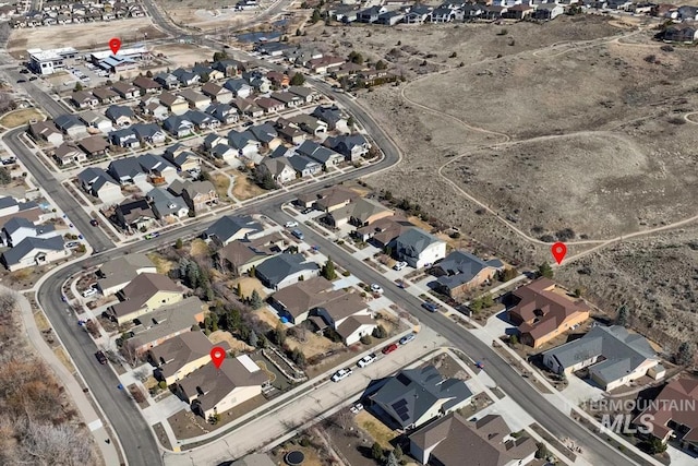 birds eye view of property with a residential view