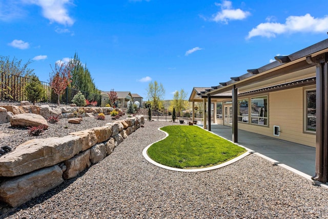 view of yard with fence and a patio area