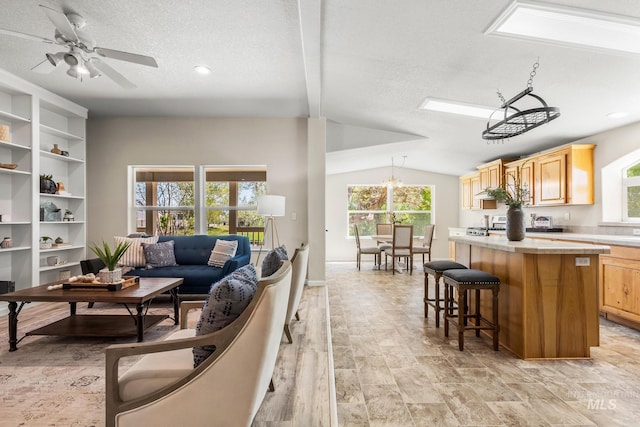 315 Bard Ave, Middleton, ID 83644 - living area featuring a textured ceiling, lofted ceiling, a ceiling fan, and recessed lighting