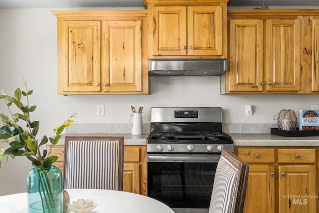 315 Bard Ave, Middleton, ID 83644 - kitchen featuring stainless steel gas range oven, ventilation hood, and light countertops