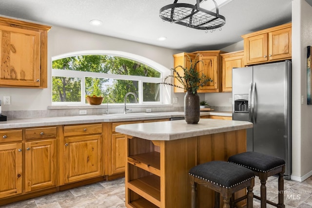 315 Bard Ave, Middleton, ID 83644 - kitchen featuring stainless steel fridge with ice dispenser, a sink, light countertops, a center island, and recessed lighting