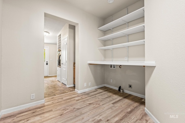 315 Bard Ave, Middleton, ID 83644 - laundry area with wood finished floors, hookup for a washing machine, and baseboards