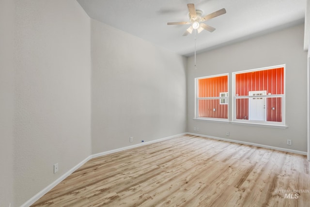 315 Bard Ave, Middleton, ID 83644 - empty room with wood finished floors, a ceiling fan, and baseboards