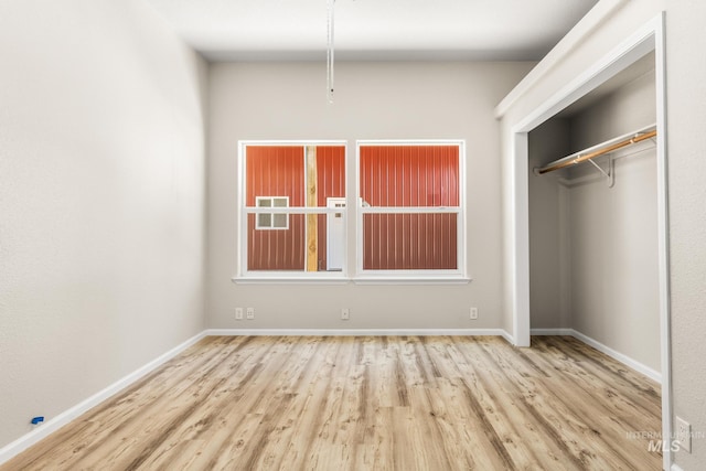 315 Bard Ave, Middleton, ID 83644 - unfurnished bedroom with wood finished floors, baseboards, and a closet