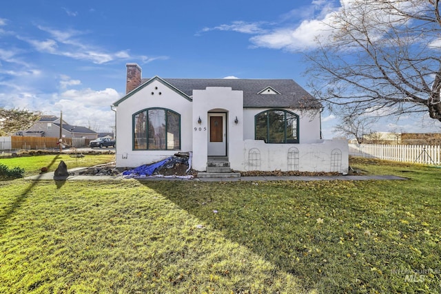 view of front of property with a front lawn