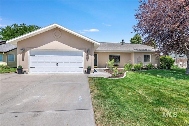 1827 Targhee Dr, Twin Falls, ID 83301 - ranch-style home featuring stucco siding, driveway, an attached garage, and a front yard
