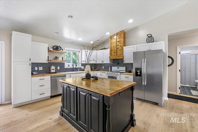1827 Targhee Dr, Twin Falls, ID 83301 - kitchen featuring appliances with stainless steel finishes, butcher block countertops, white cabinetry, and recessed lighting