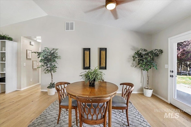 1827 Targhee Dr, Twin Falls, ID 83301 - dining area with a ceiling fan, light wood finished floors, and vaulted ceiling
