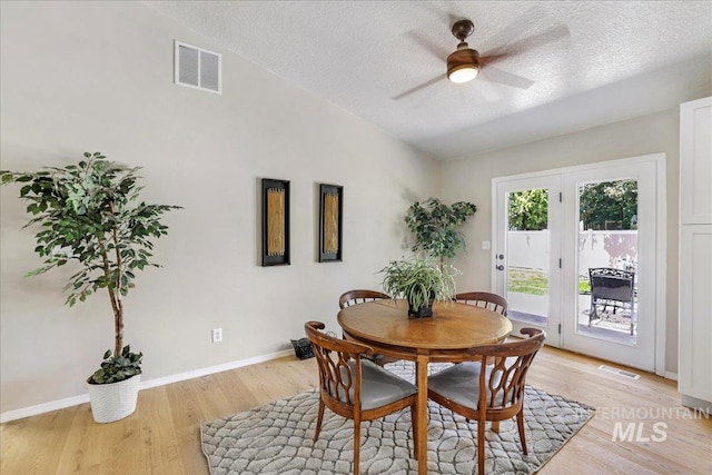 1827 Targhee Dr, Twin Falls, ID 83301 - dining space featuring a ceiling fan, a textured ceiling, light wood-style flooring, and lofted ceiling